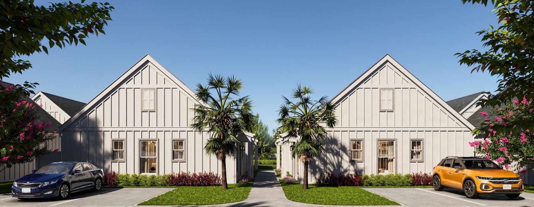 a row of houses with driveways and trees in front of them